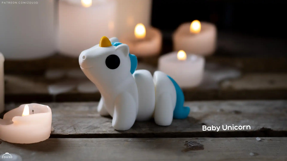 Full view of the white Baby Unicorn with blue mane and yellow horn, creator photograph